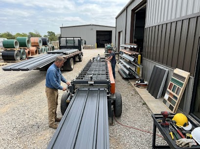 Workers assembling metal roofing materials.