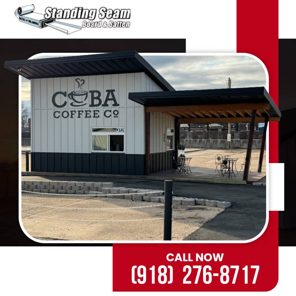 The exterior of Coba Coffee Co displaying white and black board and batten metal siding under a dark overhang.